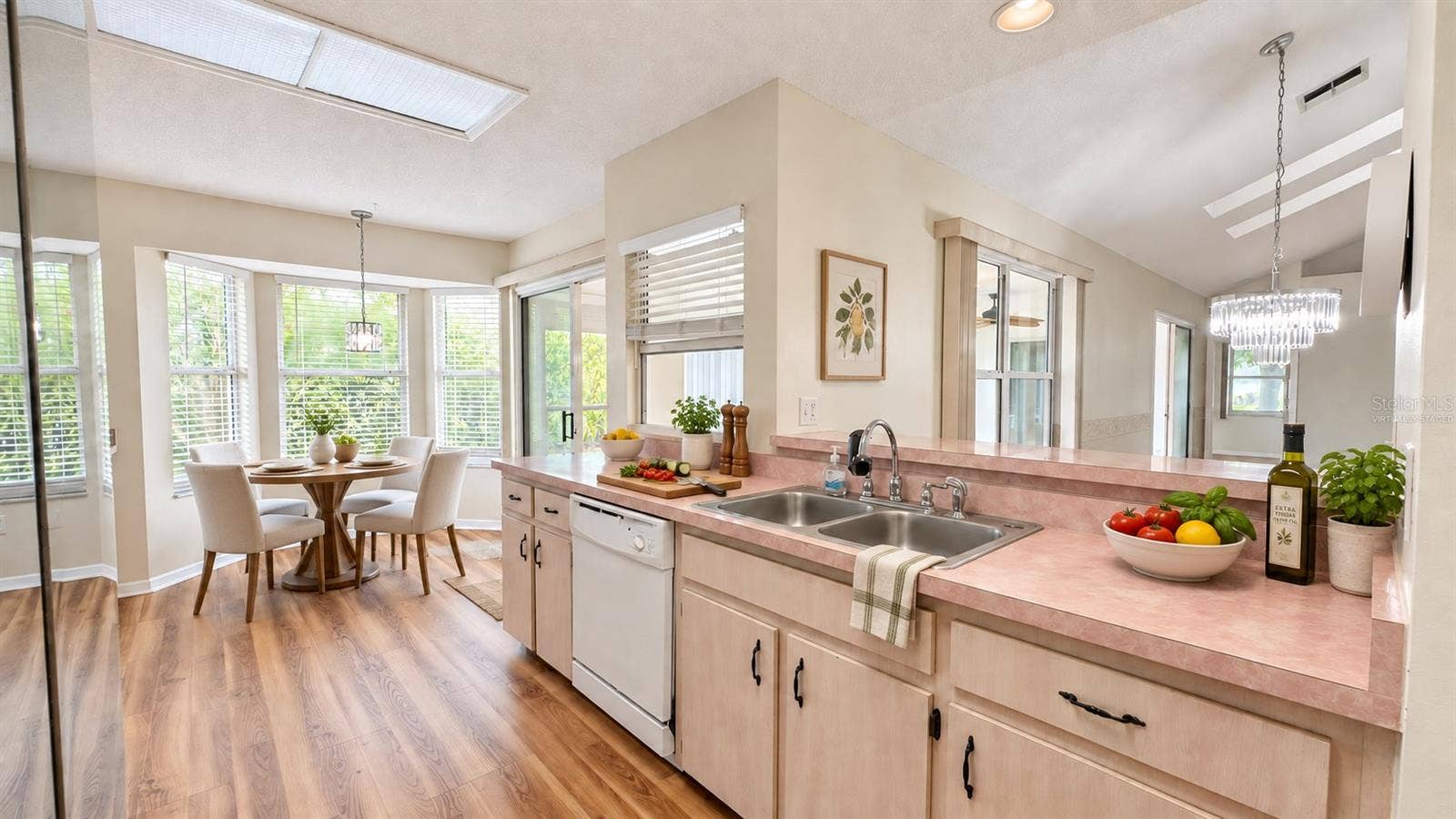 6501 SW 84TH PLACE ROAD, Ocala, FL 34476 Large kitchen with breakfast room facing the backyard. Virtually staged.