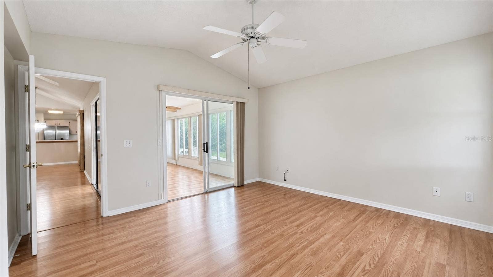 6501 SW 84TH PLACE ROAD, Ocala, FL 34476 Master bedroom facing the side and lanai features large WIC and bath.