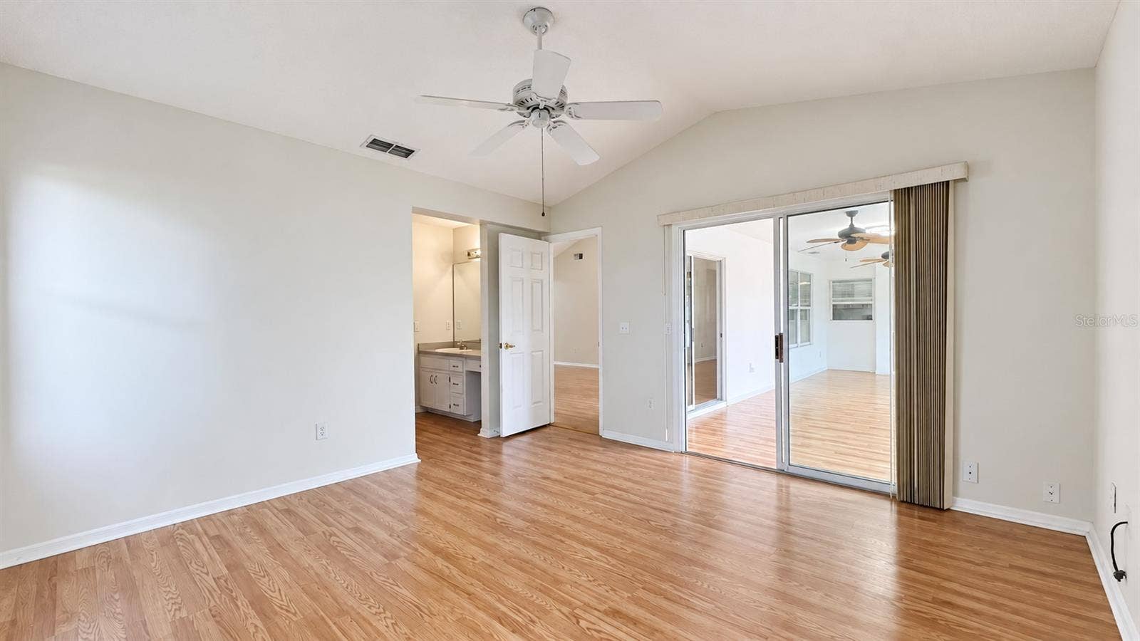 6501 SW 84TH PLACE ROAD, Ocala, FL 34476 Master bedroom facing the side and lanai features large WIC and bath.
