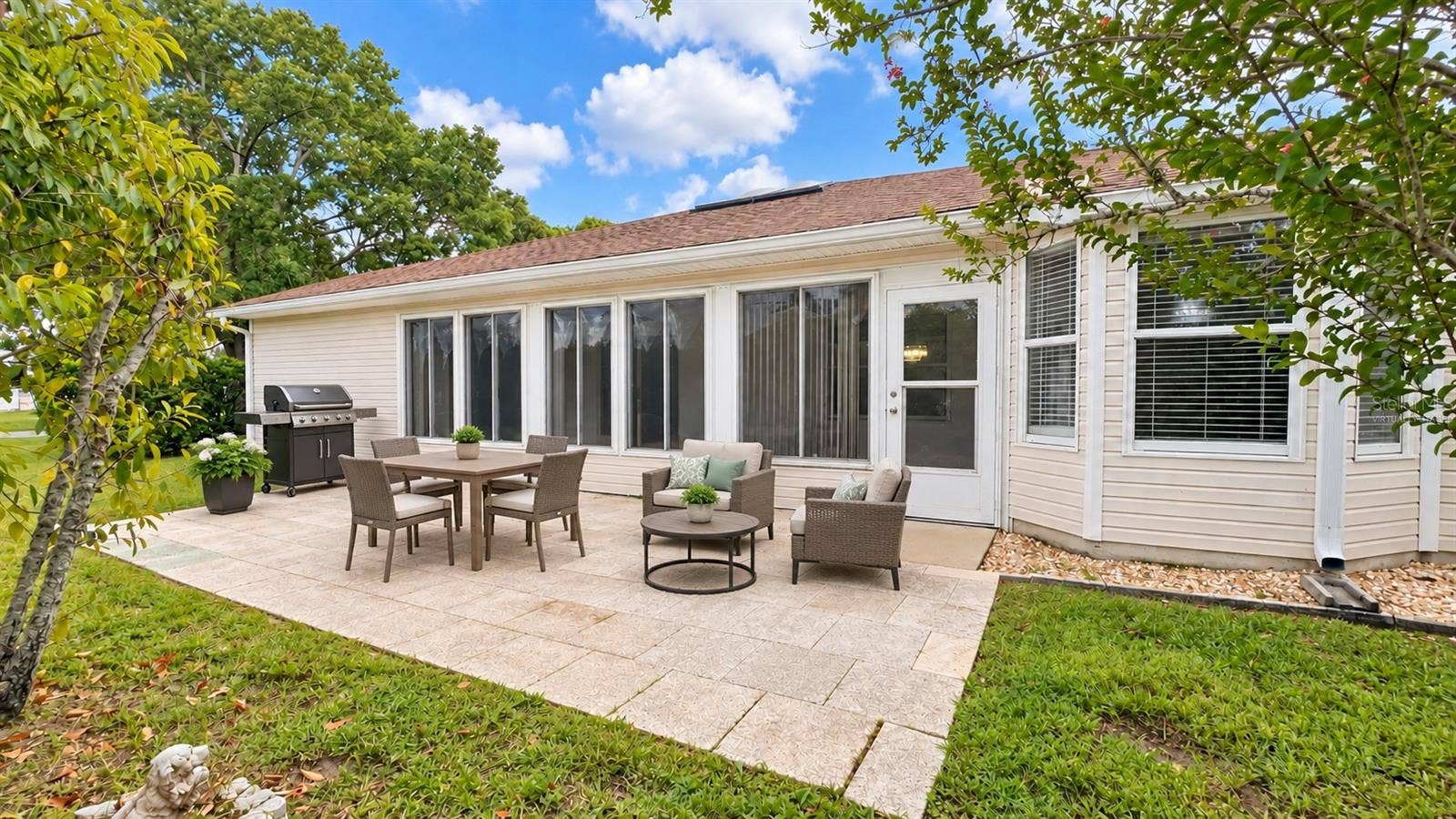 6501 SW 84TH PLACE ROAD, Ocala, FL 34476 Large back patio with plenty of space to entertain and privacy. Virtually staged.