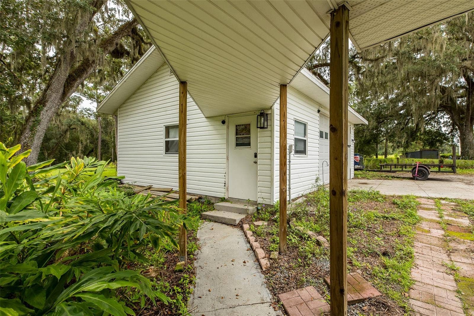 1205 S MAIN STREET, Brooksville, FL 34601 Walkway from house to detached Garage
