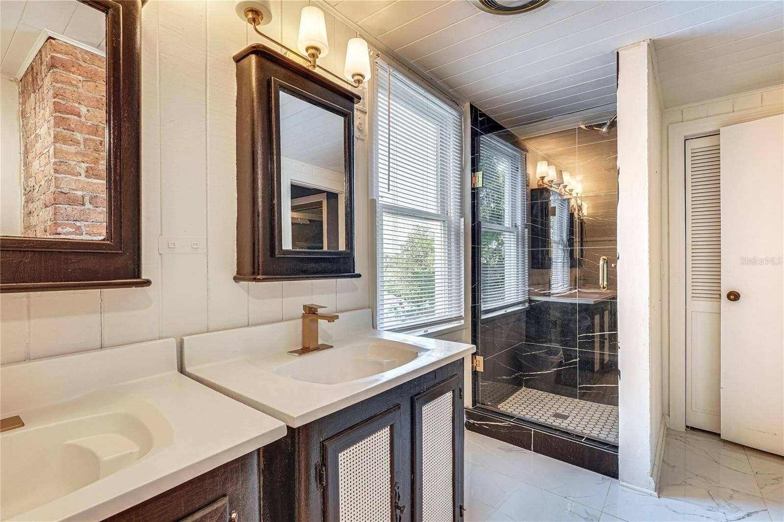 743 E FORT KING STREET, Ocala, FL 34471 Updated Bathroom with Double Vanity and Exposed Brick