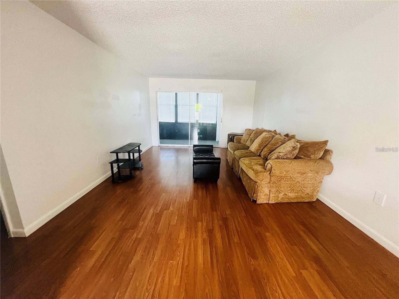 5245 AMULET DRIVE, #207, New Port Richey, FL 34652 LIVING ROOM VIEW FROM DINING AREA