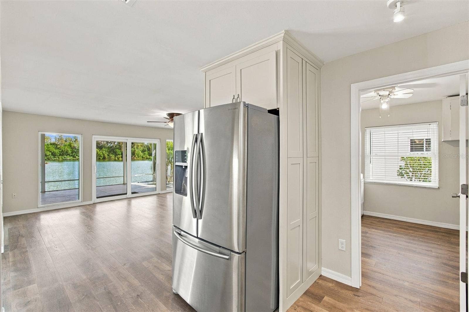 1615 BUNKER HILL DRIVE, Sun City Center, FL 33573 Dining room and looking into laundry room from kitchen
