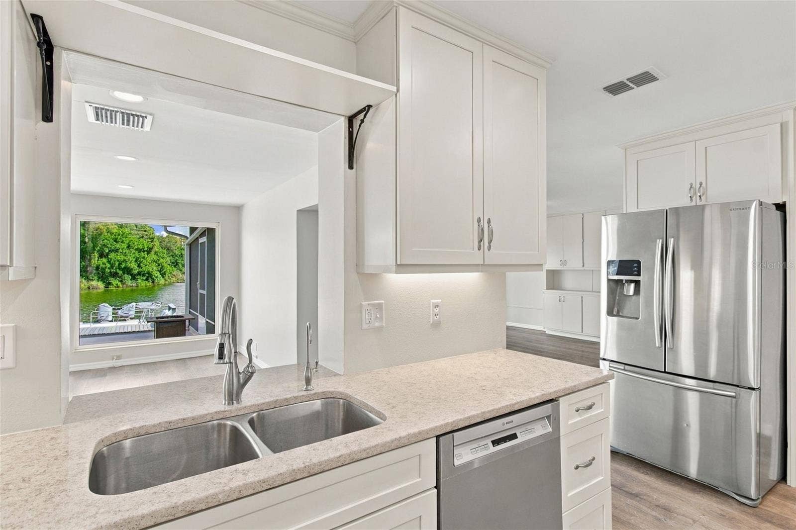1615 BUNKER HILL DRIVE, Sun City Center, FL 33573 lake view from kitchen