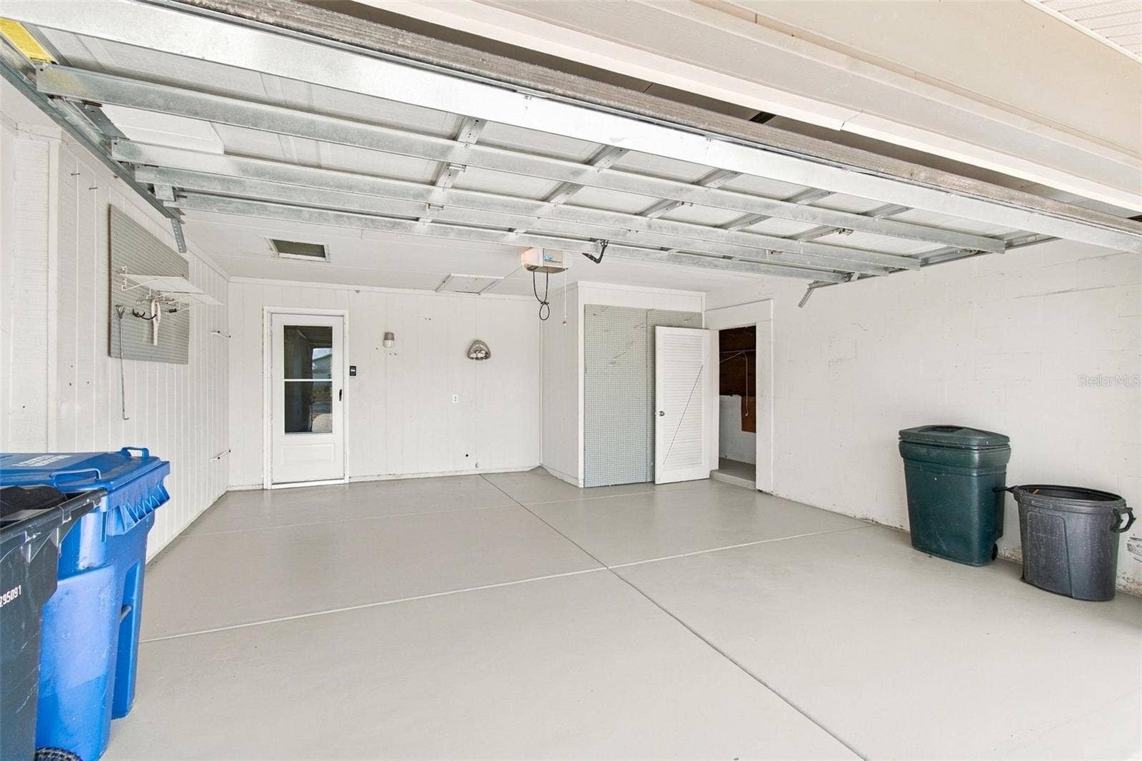 1615 BUNKER HILL DRIVE, Sun City Center, FL 33573 garage with storage closet