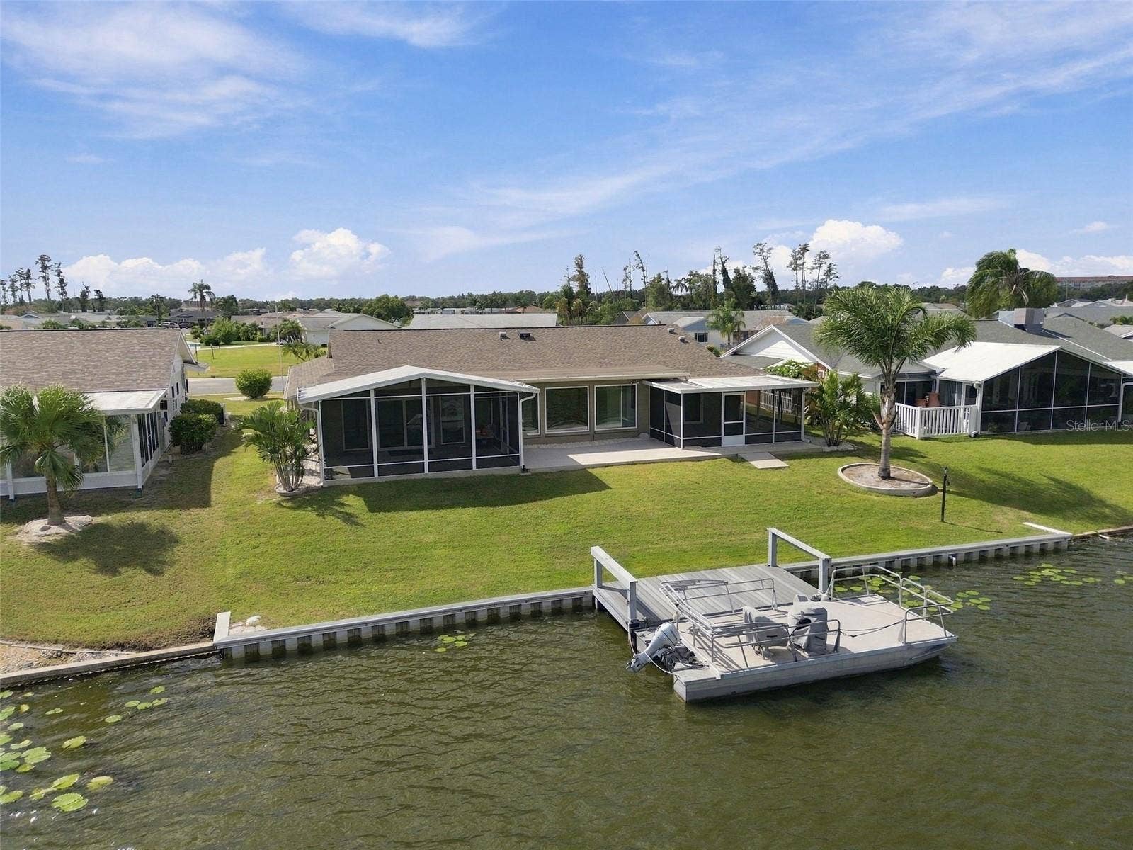 1615 BUNKER HILL DRIVE, Sun City Center, FL 33573 Yard and dock. Pontoon Boat negotiable!