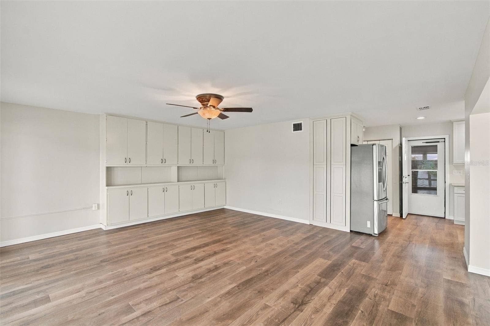 1615 BUNKER HILL DRIVE, Sun City Center, FL 33573 Dining room showing built-ins and door to garage
