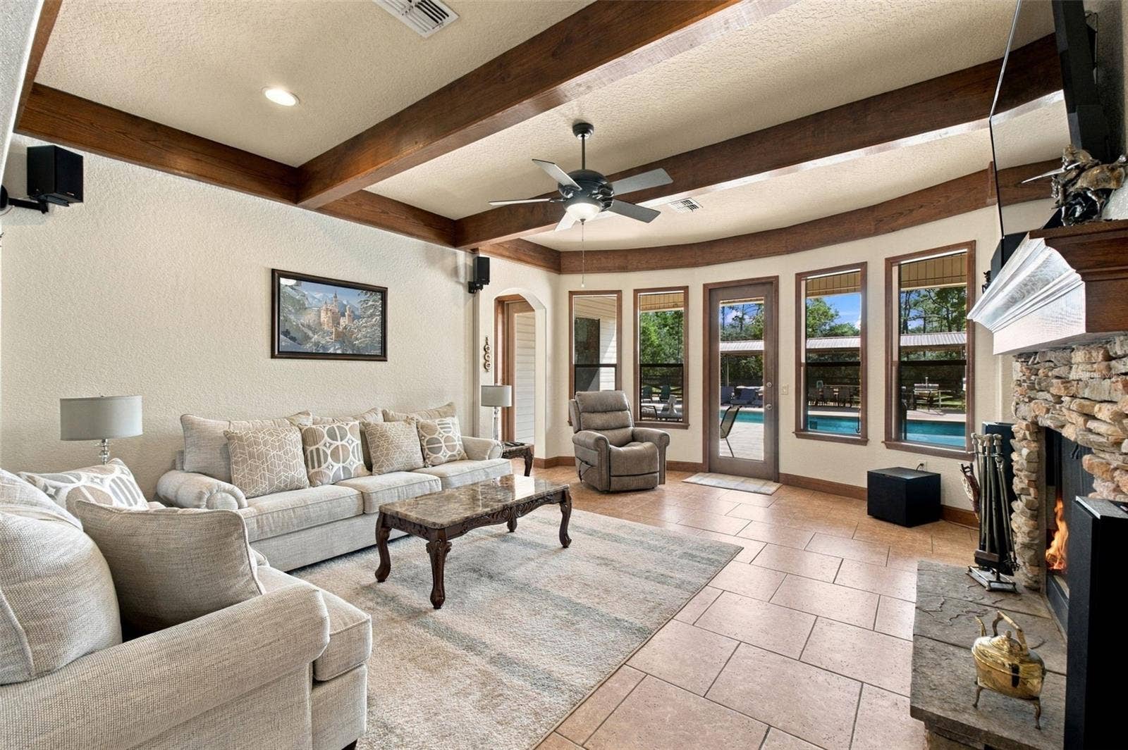 10484 GYPSY AVENUE, Weeki Wachee, FL 34613 FAMILY ROOM OVERLOOKING POOL AREA