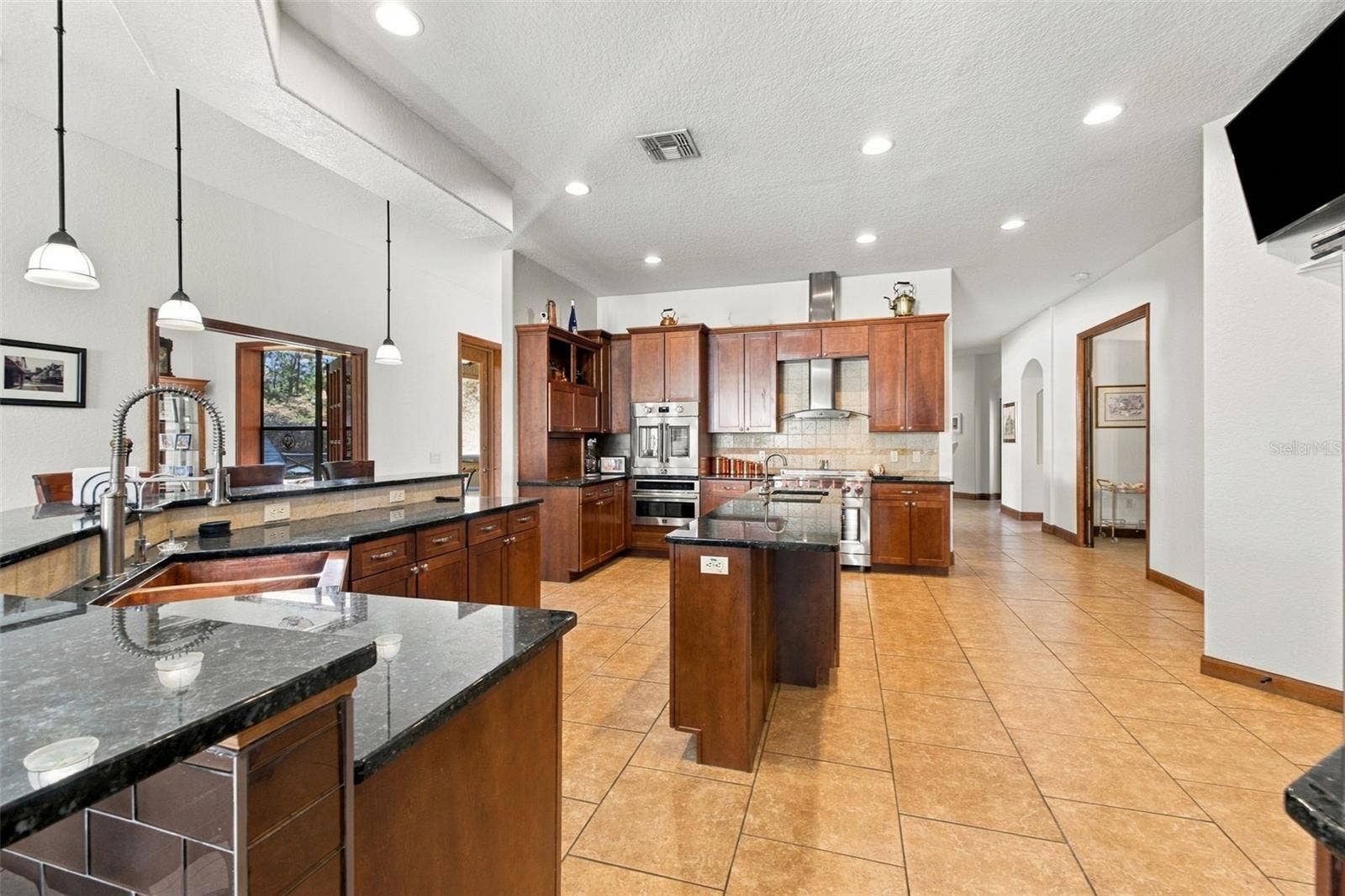 10484 GYPSY AVENUE, Weeki Wachee, FL 34613 KITCHEN WITH LARGE ISLAND