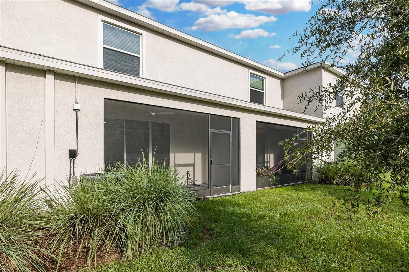 11166 CRESCENT DEER DRIVE, Land O Lakes, FL 34638 Backyard with Screened Lanai