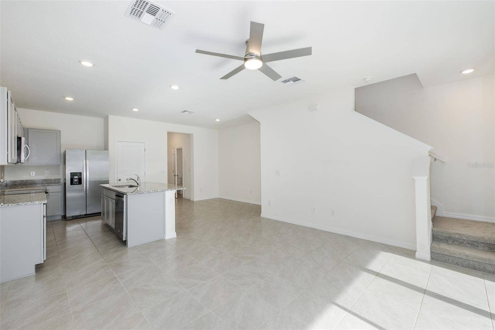 11166 CRESCENT DEER DRIVE, Land O Lakes, FL 34638 The open-concept design flows seamlessly into the living and dining areasperfect for today's lifestyle.
