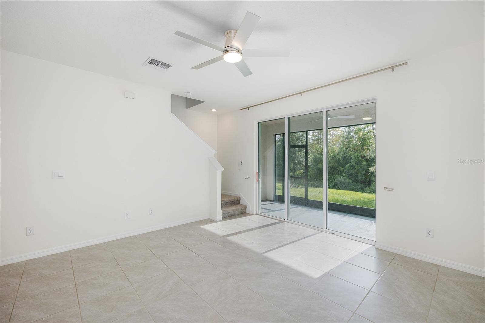11166 CRESCENT DEER DRIVE, Land O Lakes, FL 34638 Living Room with Triple Sliders out to Lanai with Gorgeous View~