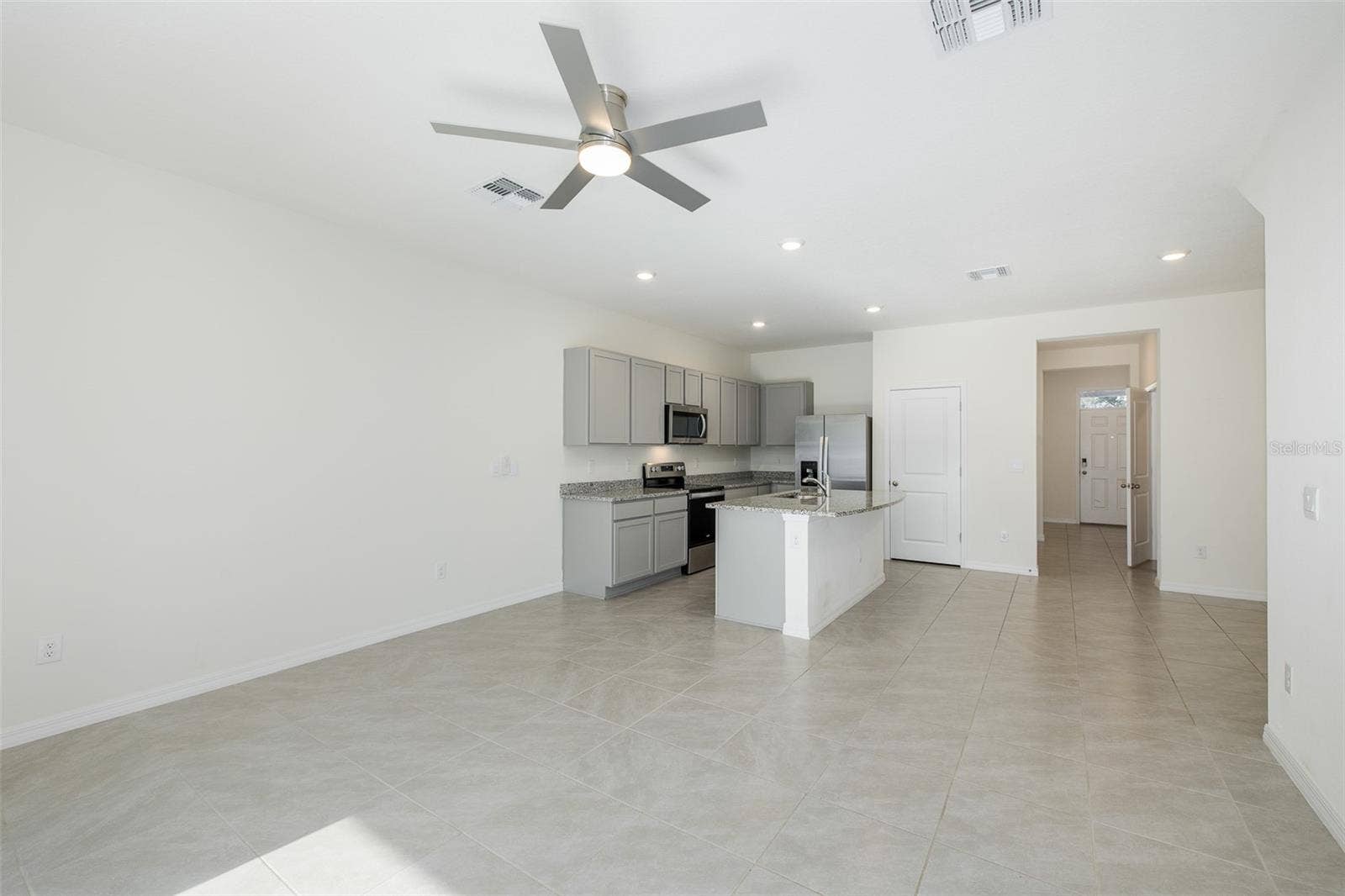 11166 CRESCENT DEER DRIVE, Land O Lakes, FL 34638 Living Room/Kitchen Combo