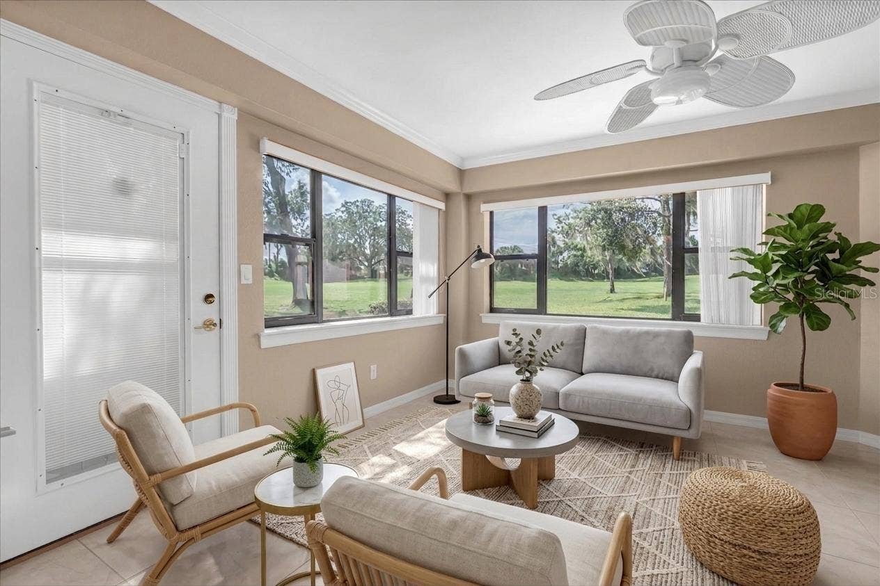 9126 BASSETT LANE, New Port Richey, FL 34655 Florida room -virtual staged for other set up ideas (not included)