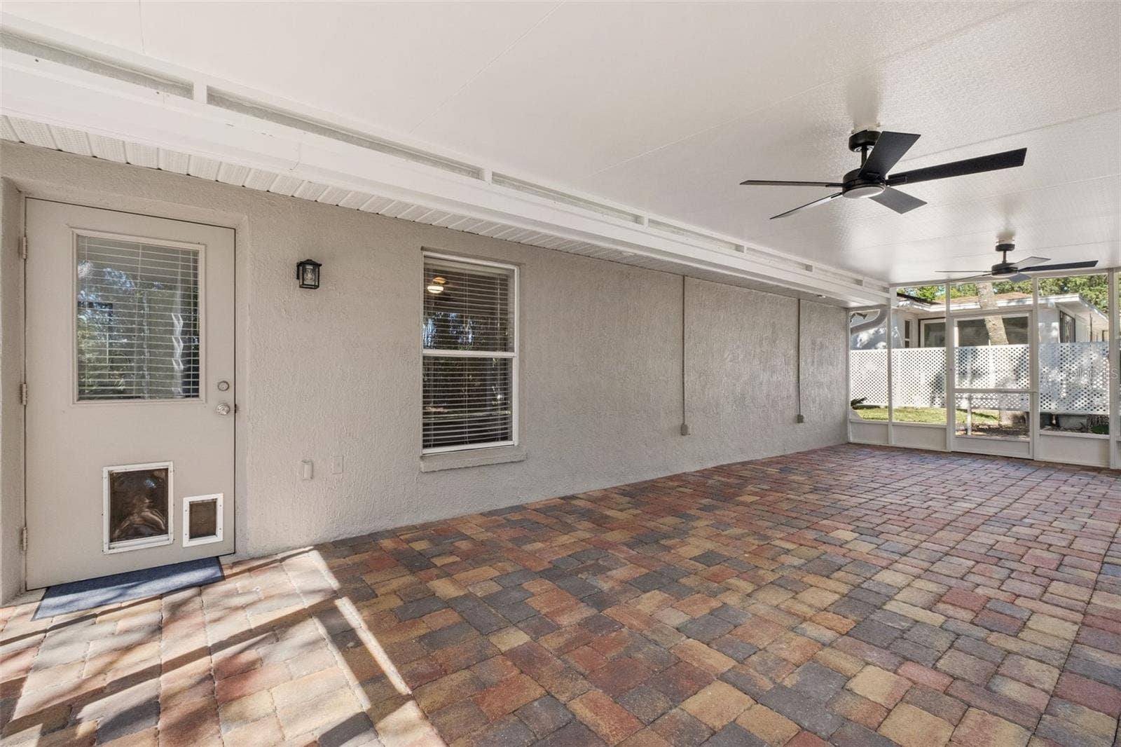 2138 FAIRVIEW ROAD, Spring Hill, FL 34609 Expansive Screened Rear Porch with Pavers