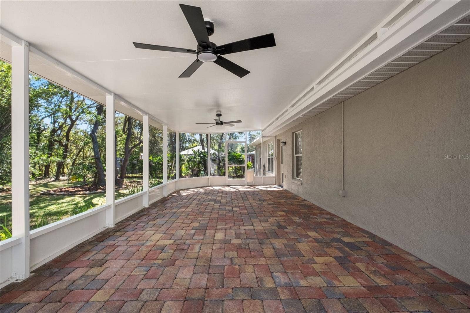 2138 FAIRVIEW ROAD, Spring Hill, FL 34609 Expansive Screened Rear Porch with Pavers