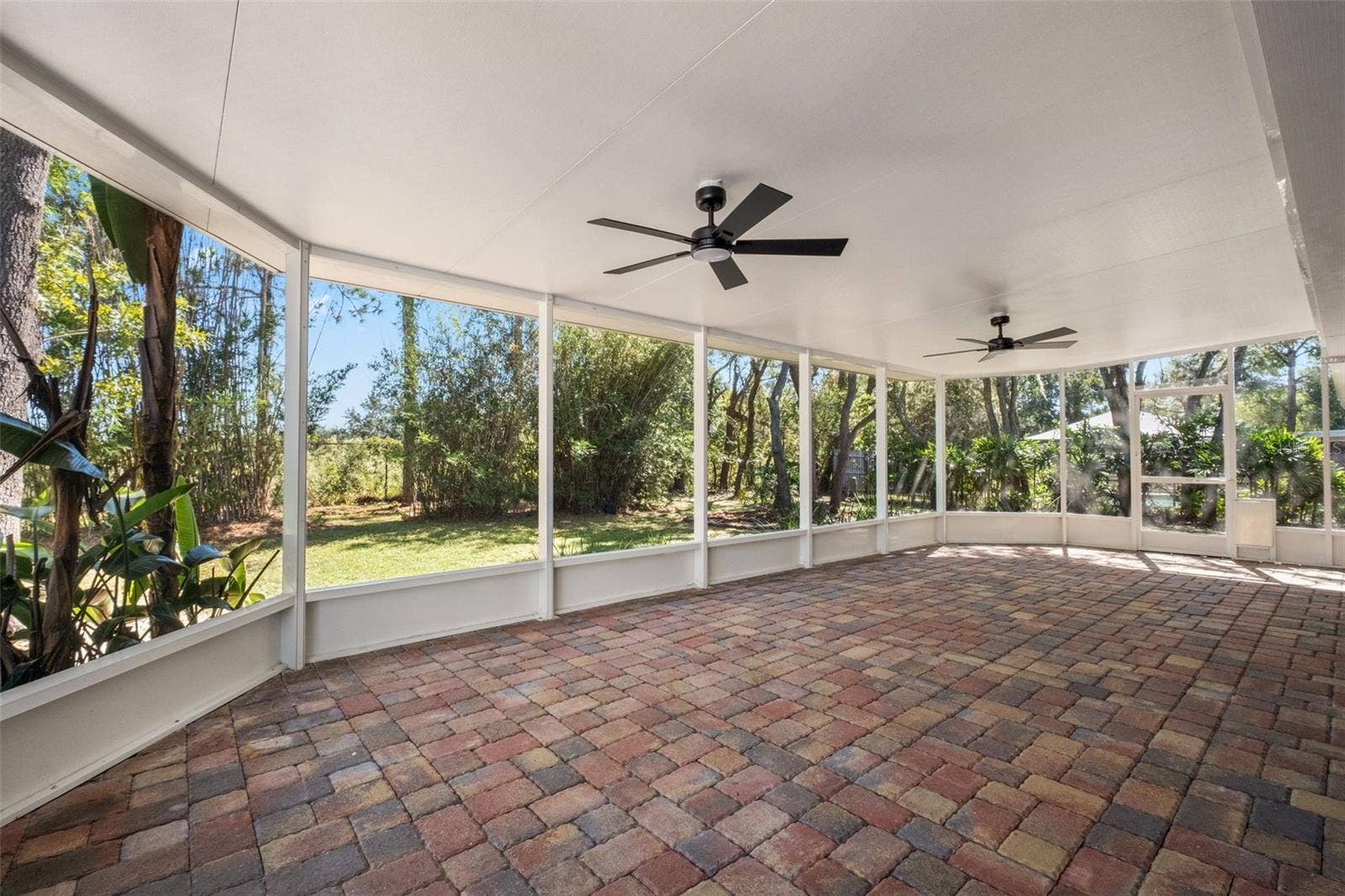 2138 FAIRVIEW ROAD, Spring Hill, FL 34609 Expansive Screened Rear Porch with Pavers
