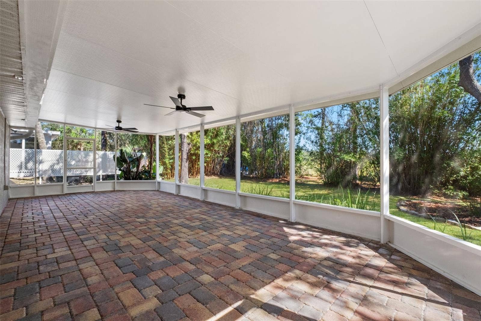 2138 FAIRVIEW ROAD, Spring Hill, FL 34609 Expansive Screened Rear Porch with Pavers