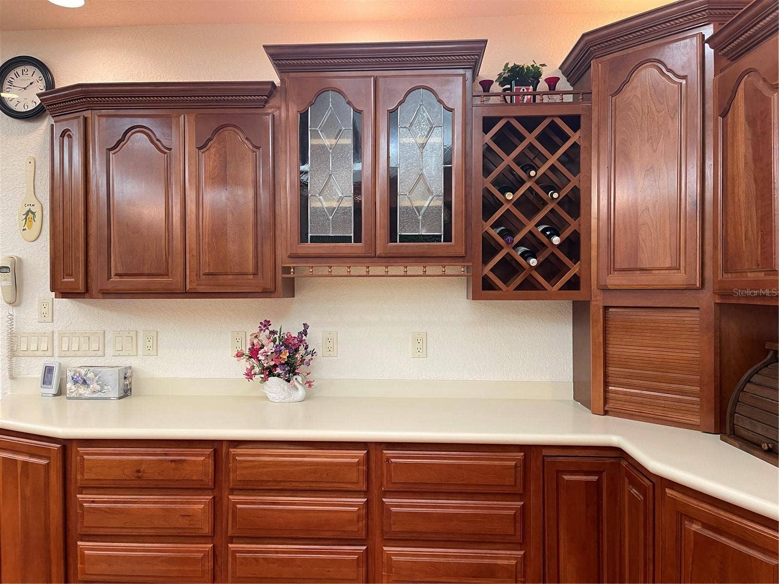 Schrock handcrafted Cherry wood cabinetry and stain glass accent panels.