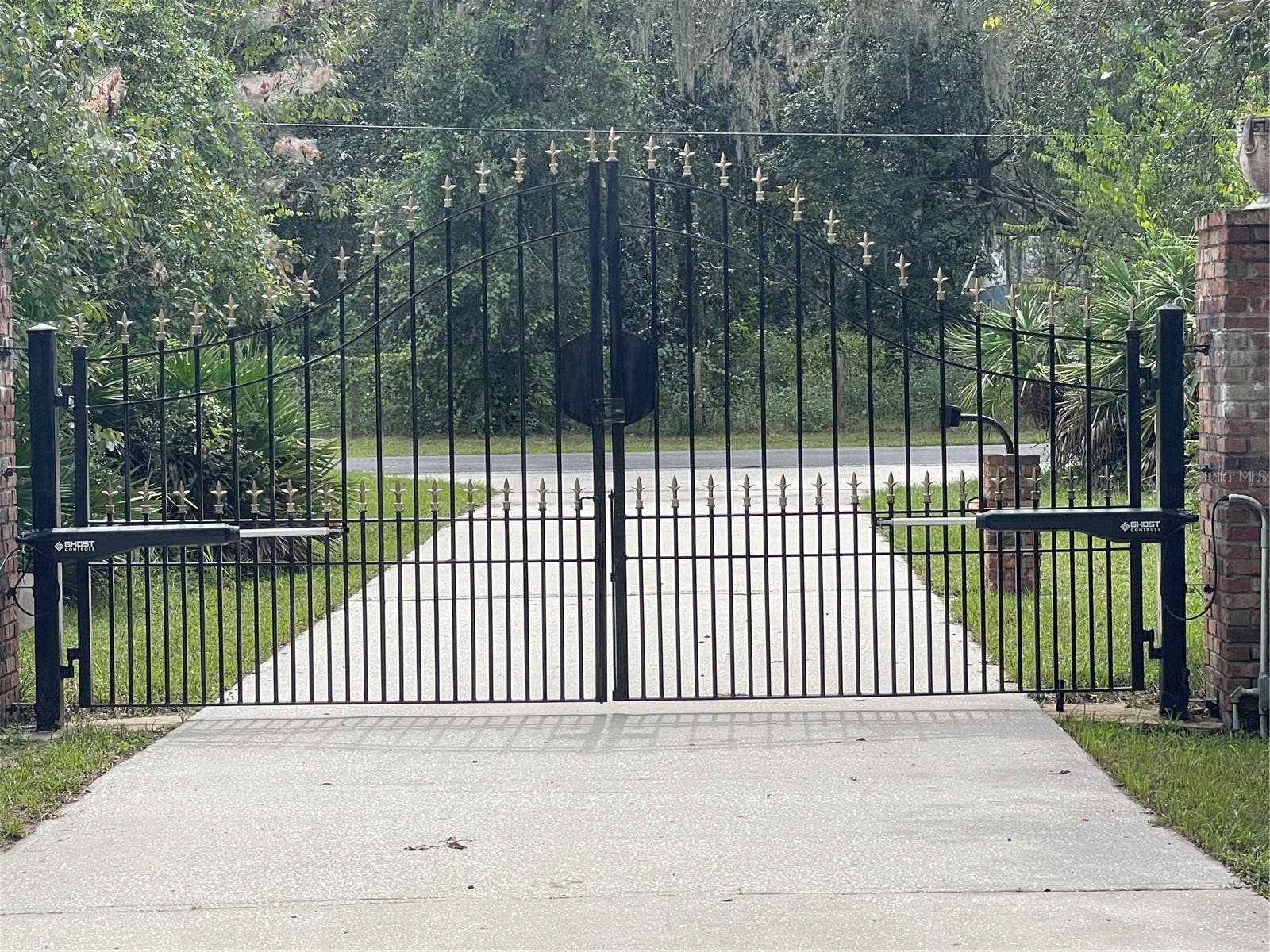 Electronic steel gate at front of 405 foot driveway.
