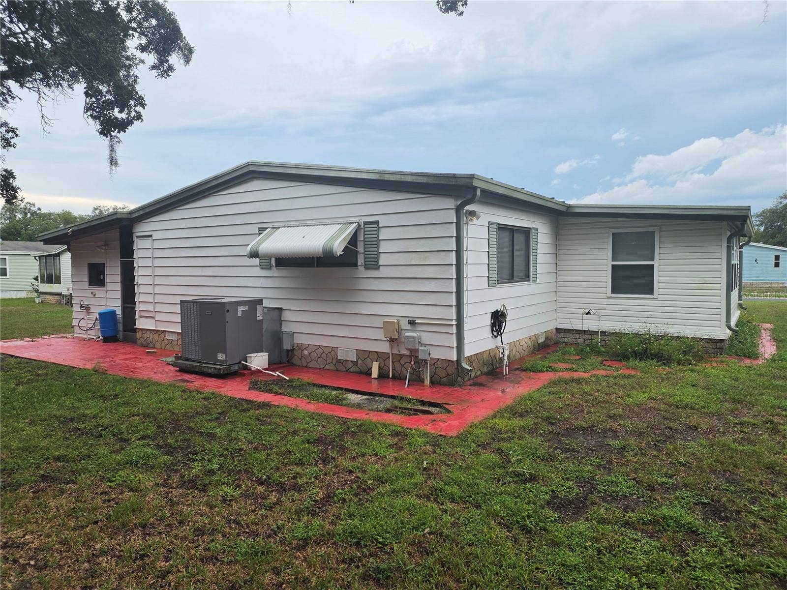 16802 HARLEY STREET, Hudson, FL 34667 EXTERIOR SIDE OF HOME