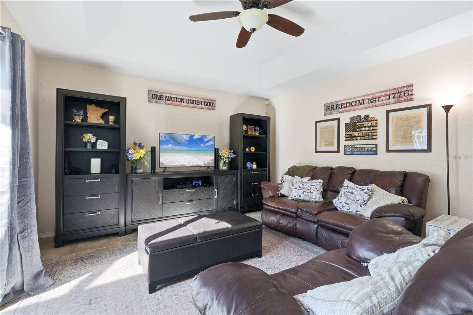 Family room off Kitchen with double pocket sliders to screen lania