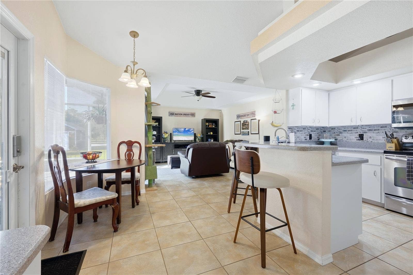 Kitchen with breakfast bar and dining area