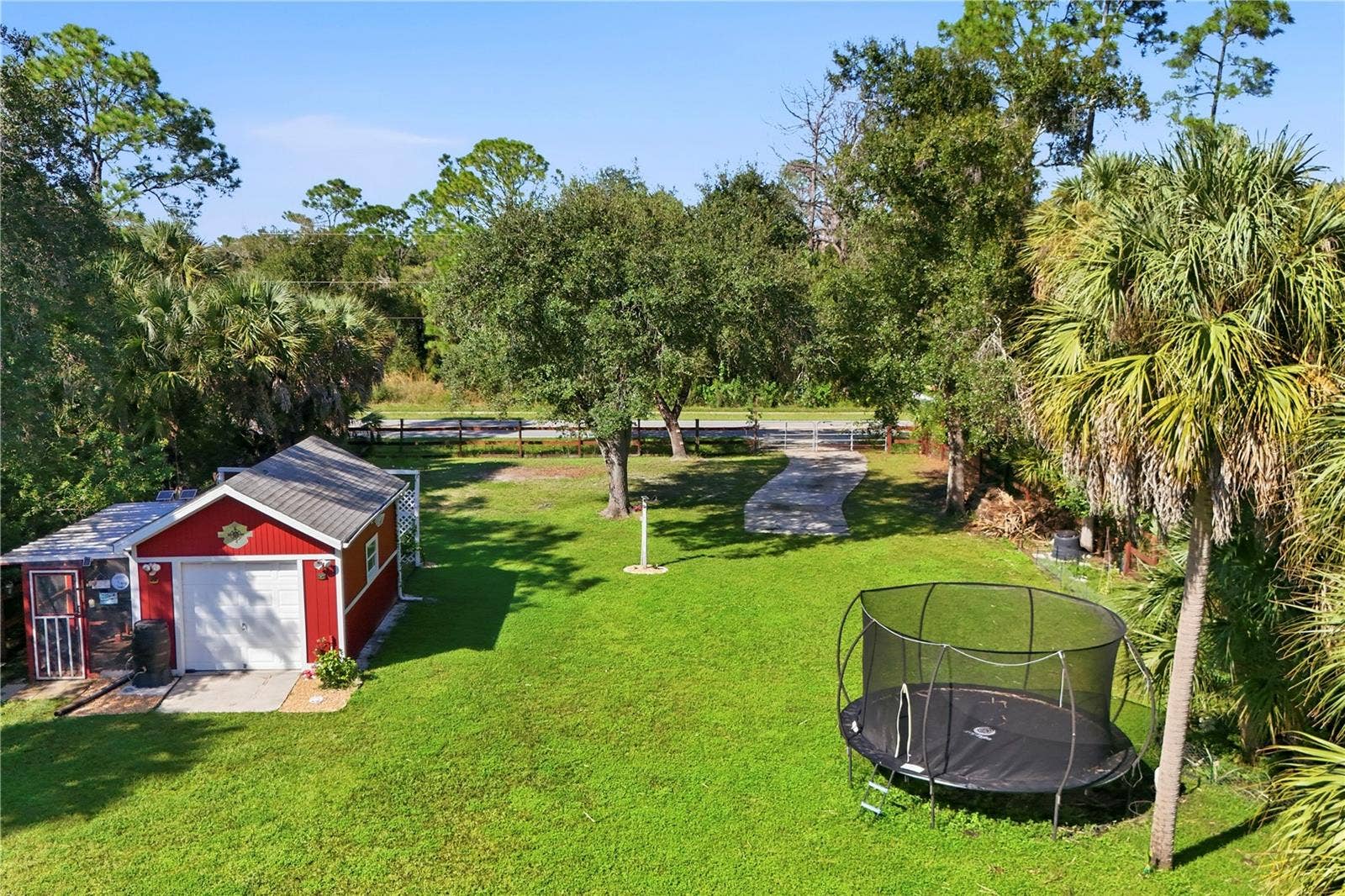 Backyard with free standing garage / workshop, chicken coop, rear gate and RV parking pad