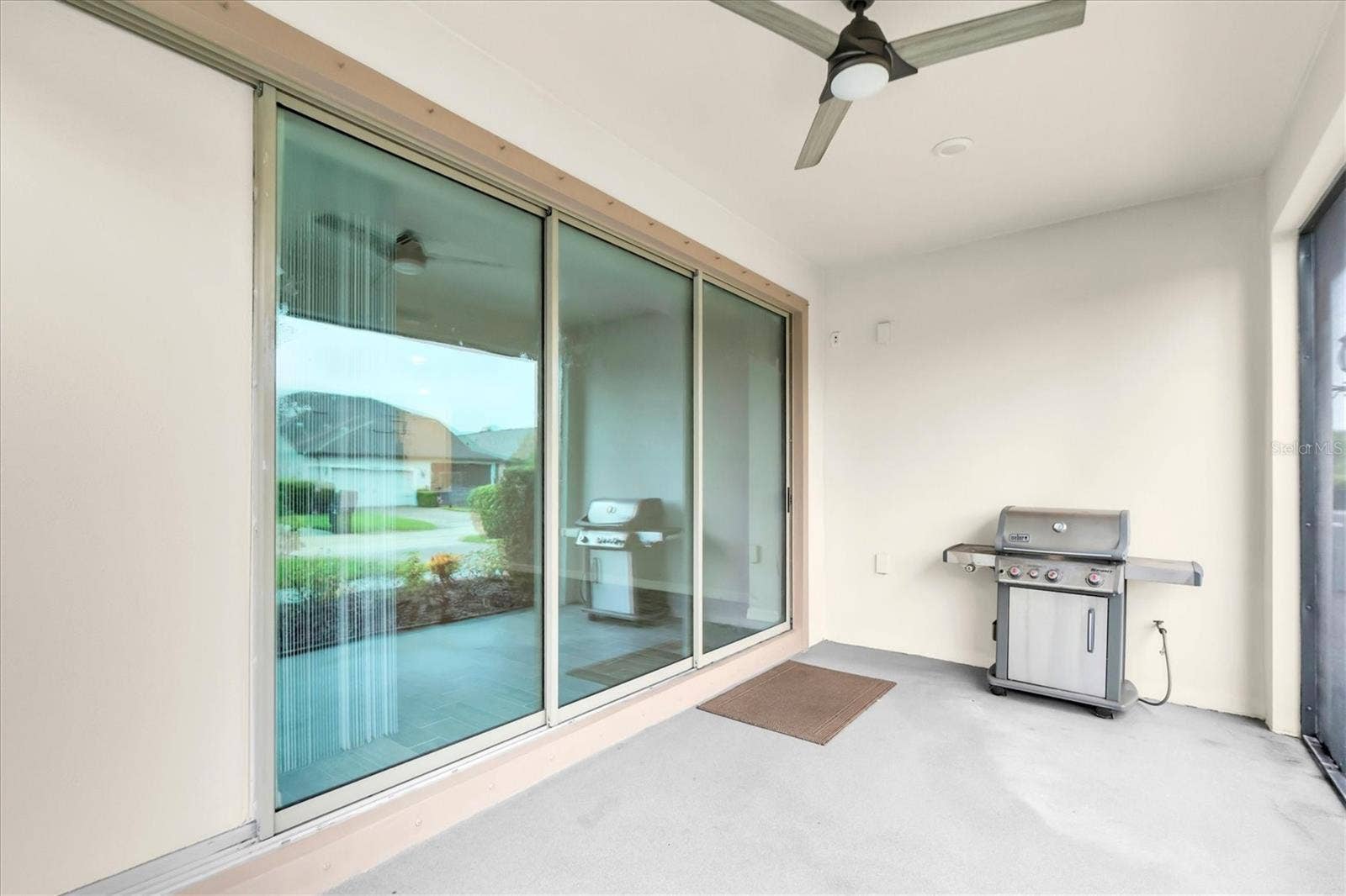 Covered lanai with sliding glass doors