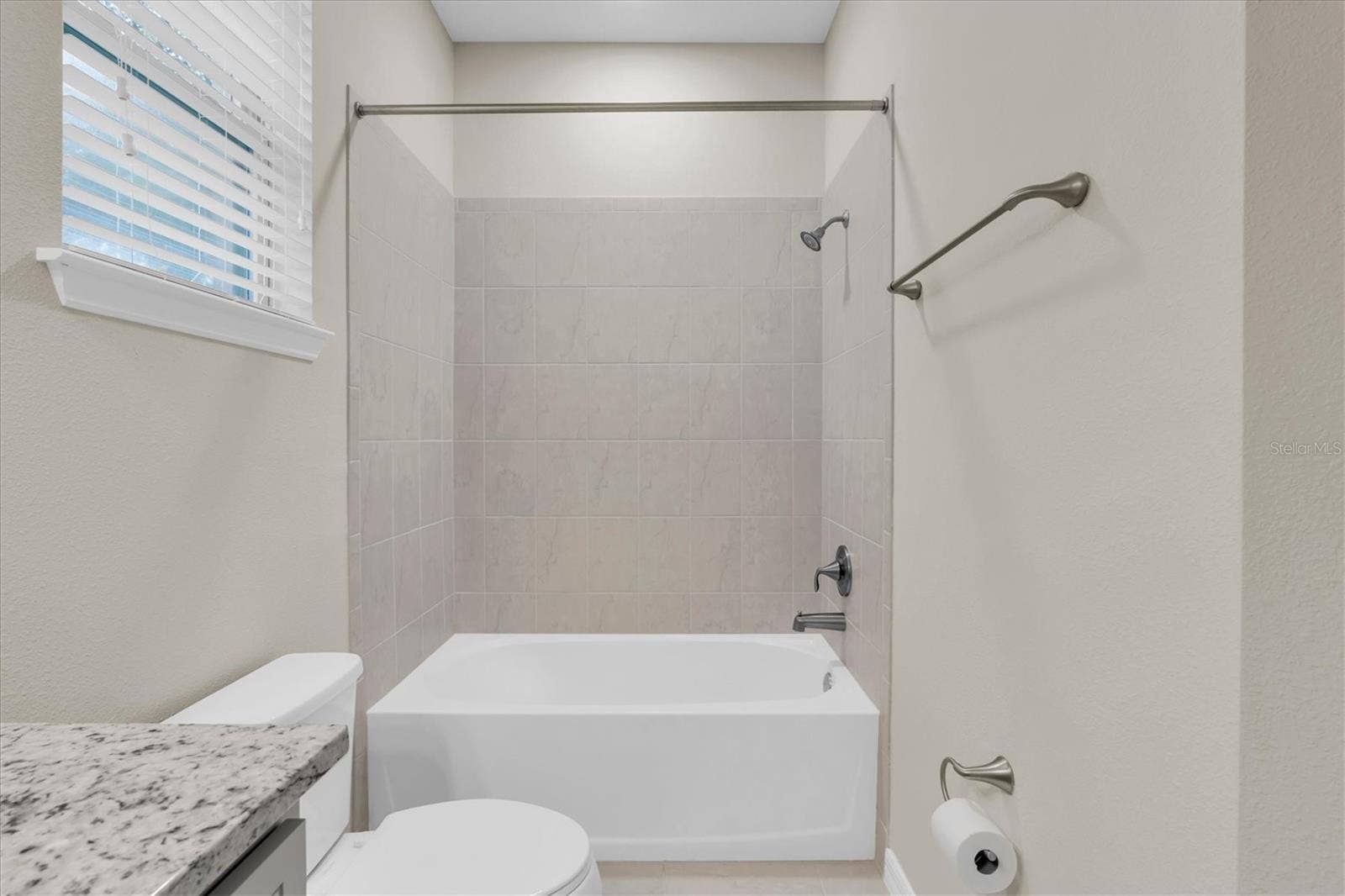 Bathroom with tub and shower