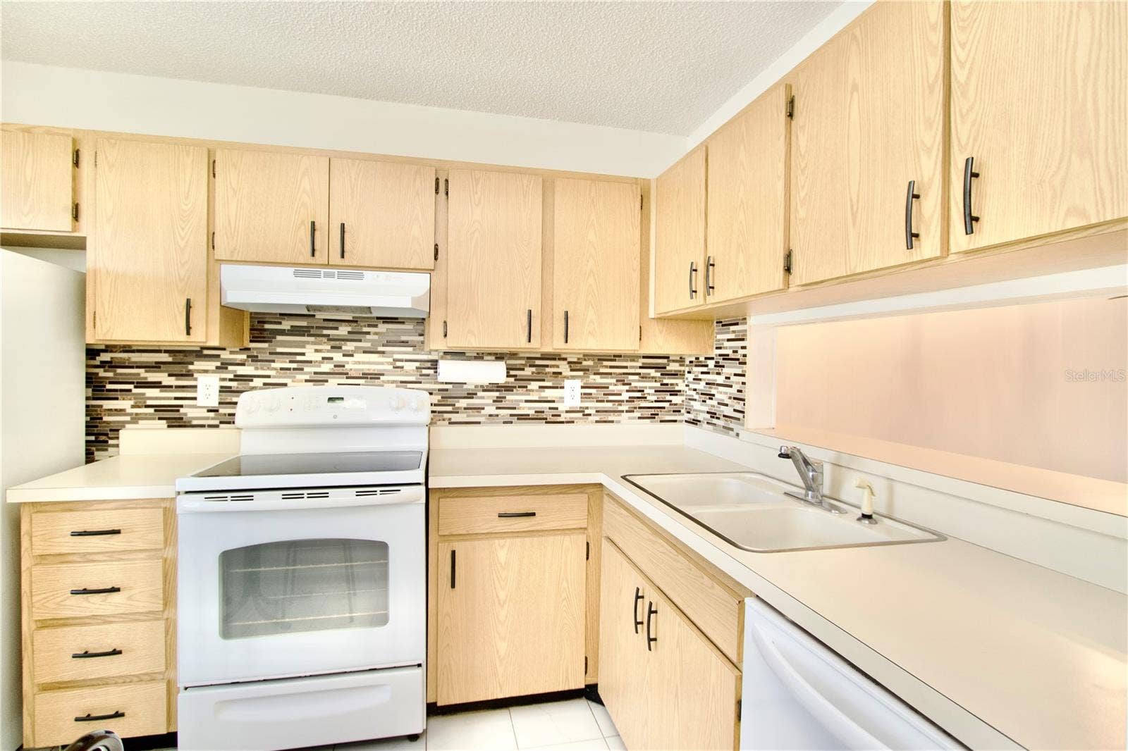 2853 FORRESTAL COURT, New Port Richey, FL 34655 Kitchen with Breakfast Bar