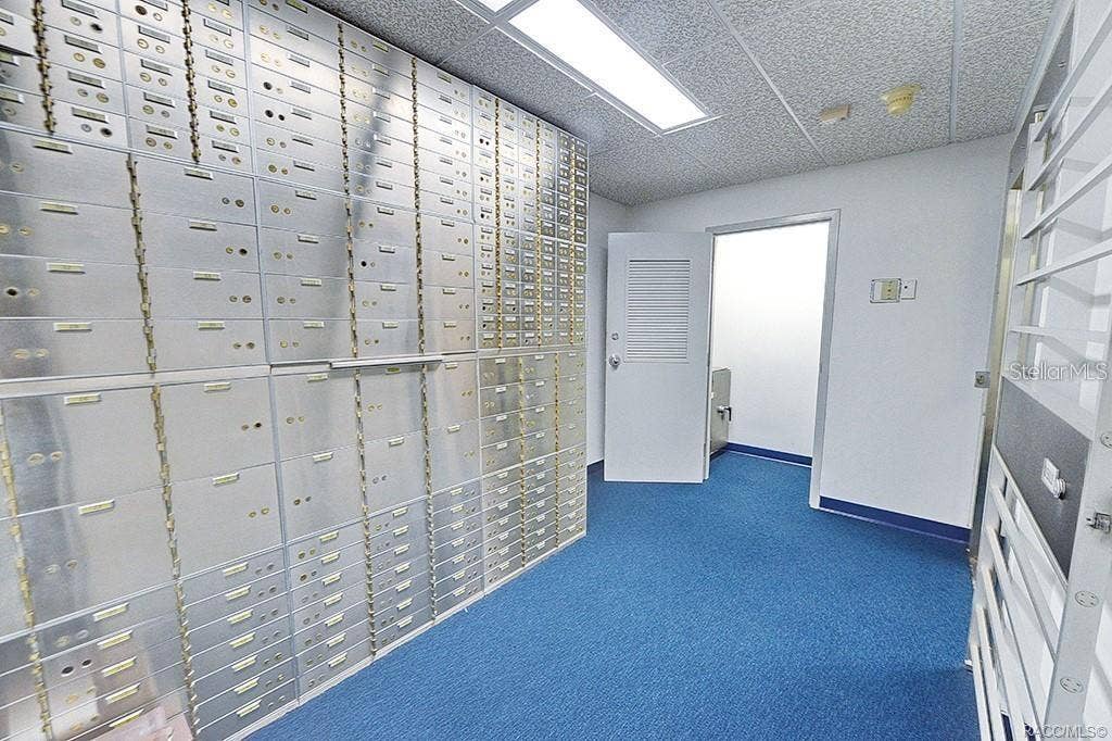 10241 N FLORIDA AVENUE, Citrus Springs, FL 34434 Vault interior with existing safe-deposit boxes.