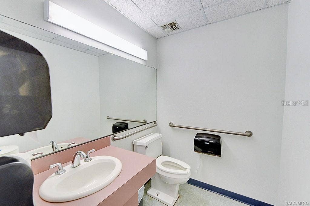 10241 N FLORIDA AVENUE, Citrus Springs, FL 34434 First restroom with existing fixtures.
