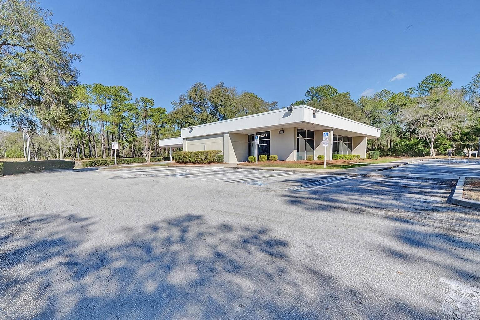 10241 N FLORIDA AVENUE, Citrus Springs, FL 34434 Freestanding 3,280 SF building with paved on-site parking. Digitally edited to remove former bank signage.