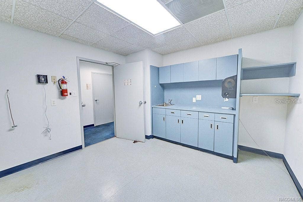 10241 N FLORIDA AVENUE, Citrus Springs, FL 34434 Break room with cabinetry, counter space, and sink.