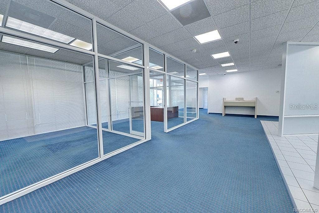10241 N FLORIDA AVENUE, Citrus Springs, FL 34434 Connected office and customer areas within the former bank layout.
