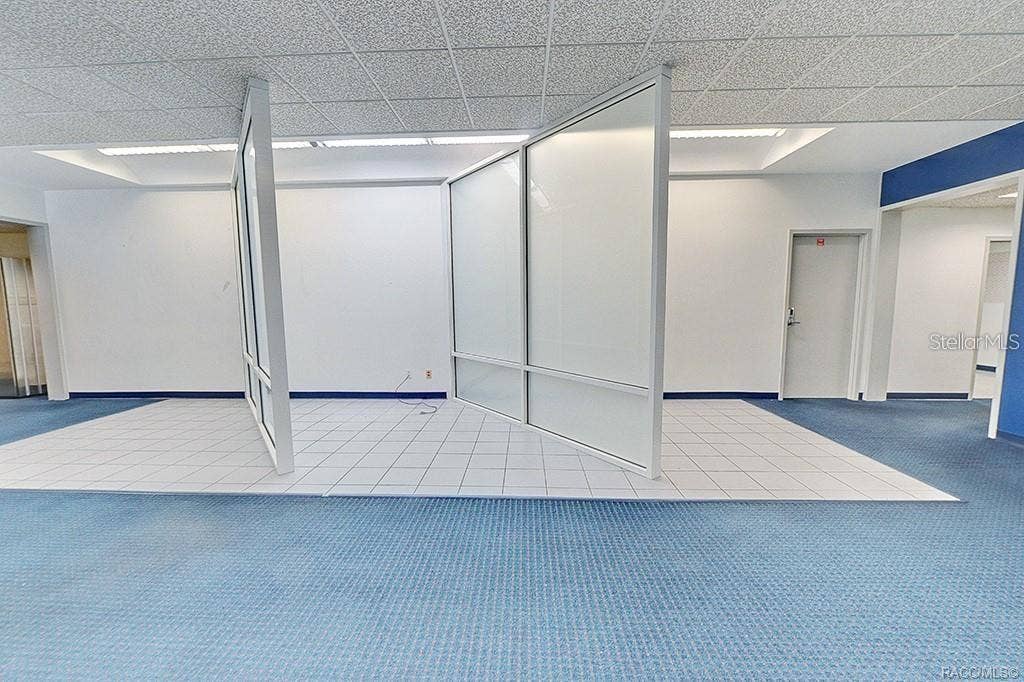 10241 N FLORIDA AVENUE, Citrus Springs, FL 34434 Interior view showing the open area and existing office partitions.