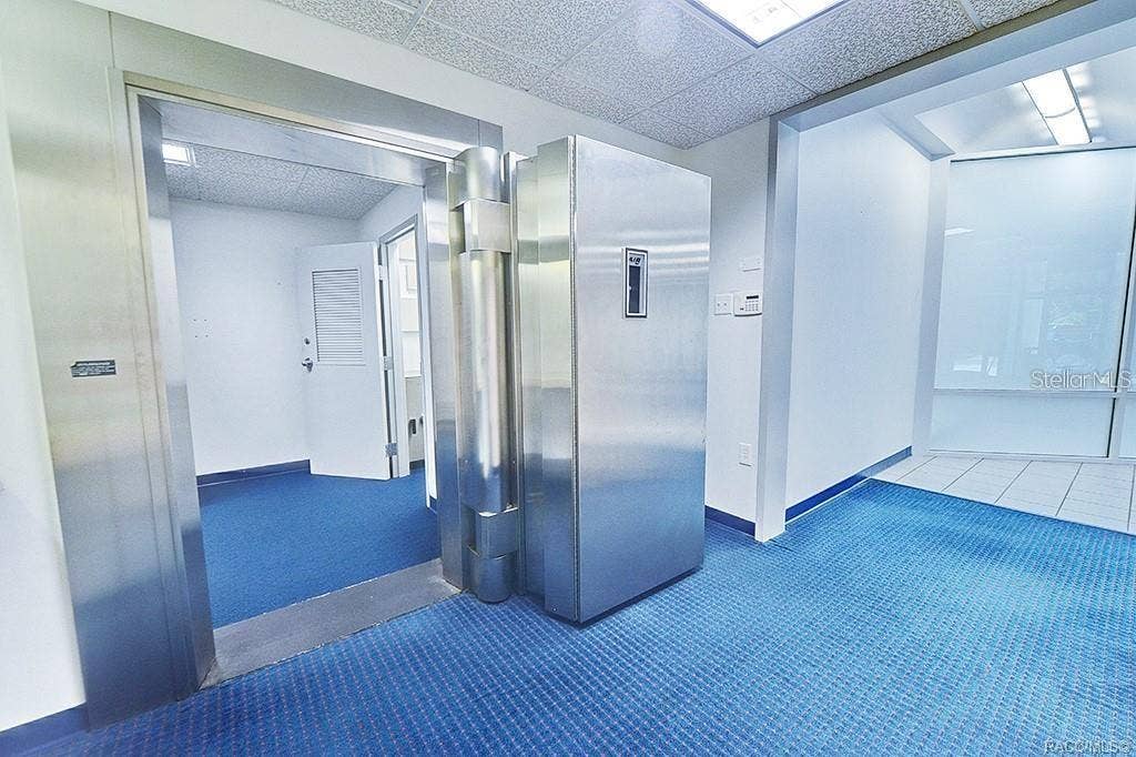 10241 N FLORIDA AVENUE, Citrus Springs, FL 34434 Existing vault entrance and adjoining interior space.