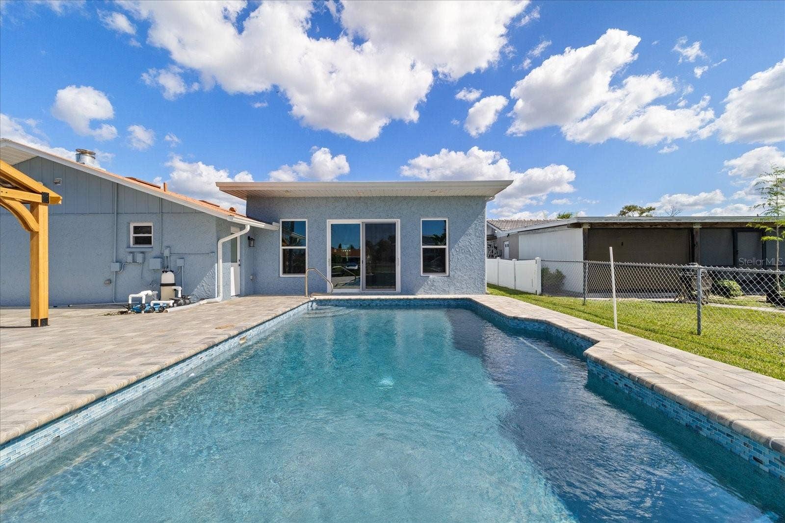 5001 MARLIN DRIVE, New Port Richey, FL 34652 Large sliders to pool and waterfront backyard