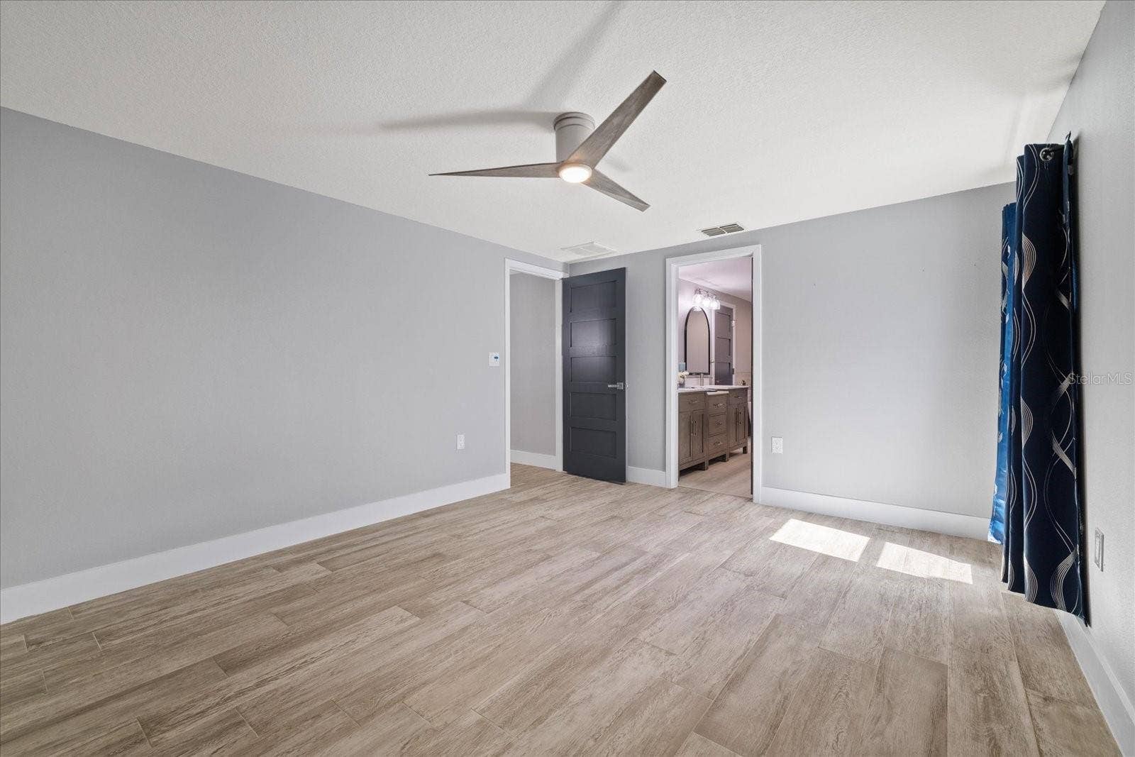 5001 MARLIN DRIVE, New Port Richey, FL 34652 Primary bedroom with ensuite
