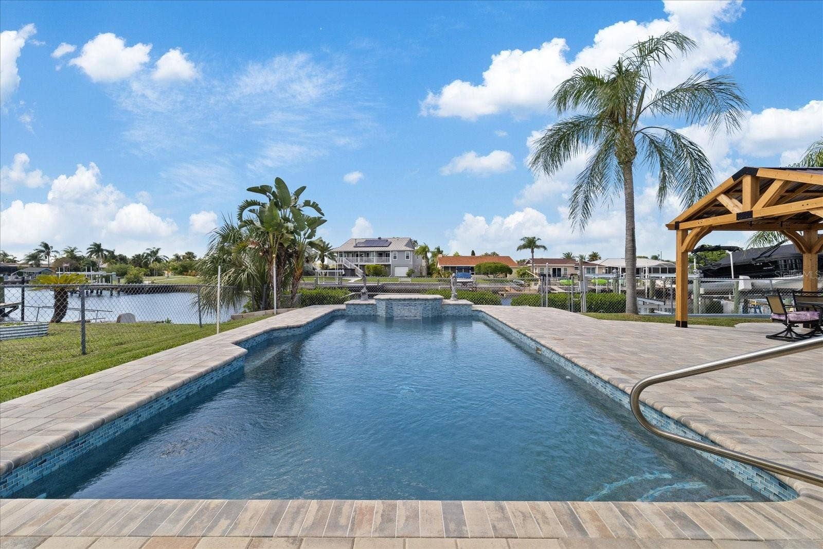 5001 MARLIN DRIVE, New Port Richey, FL 34652 View to the water of pool and waterfall feature