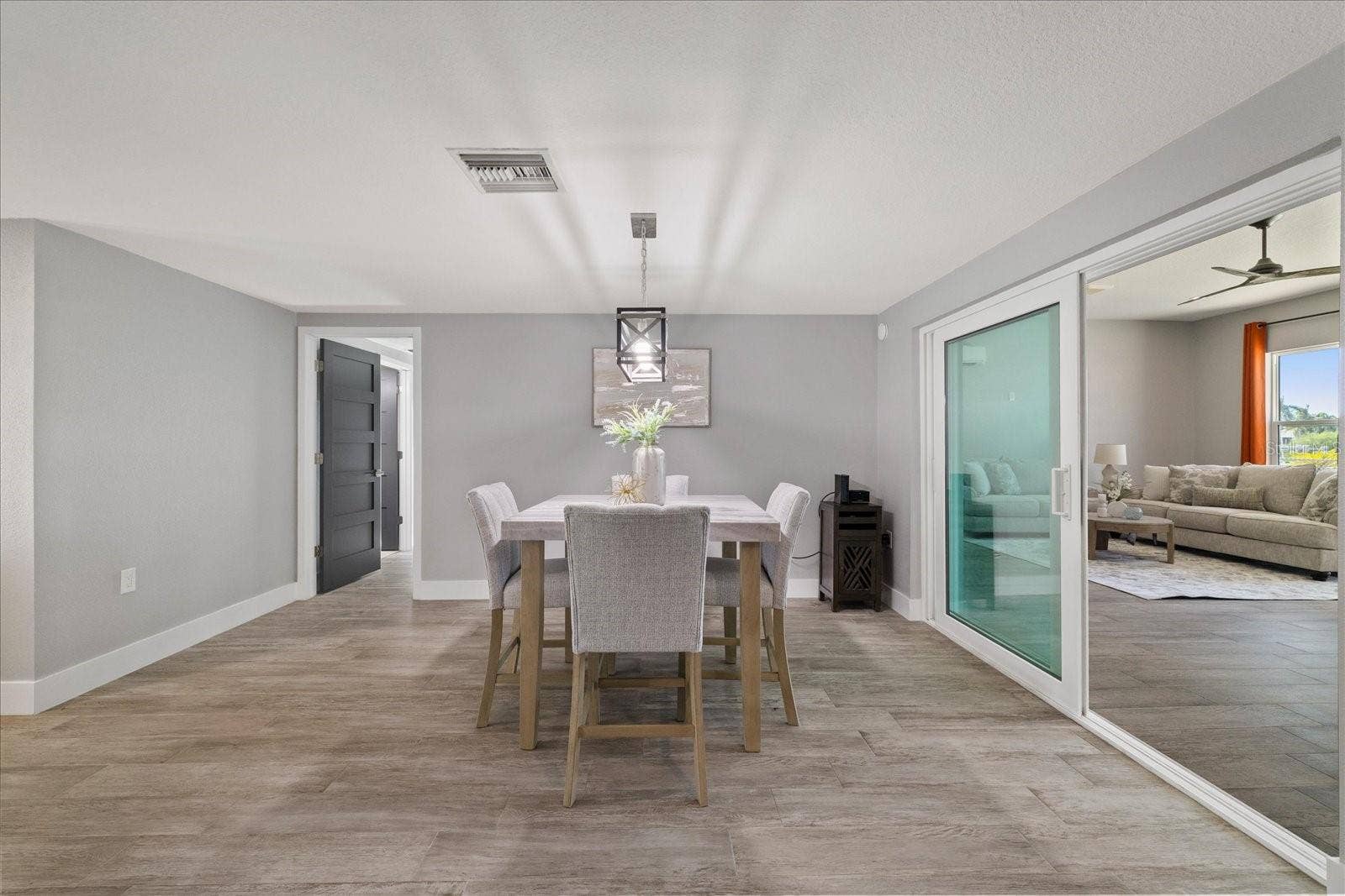 5001 MARLIN DRIVE, New Port Richey, FL 34652 Dining area and sliders to family room
