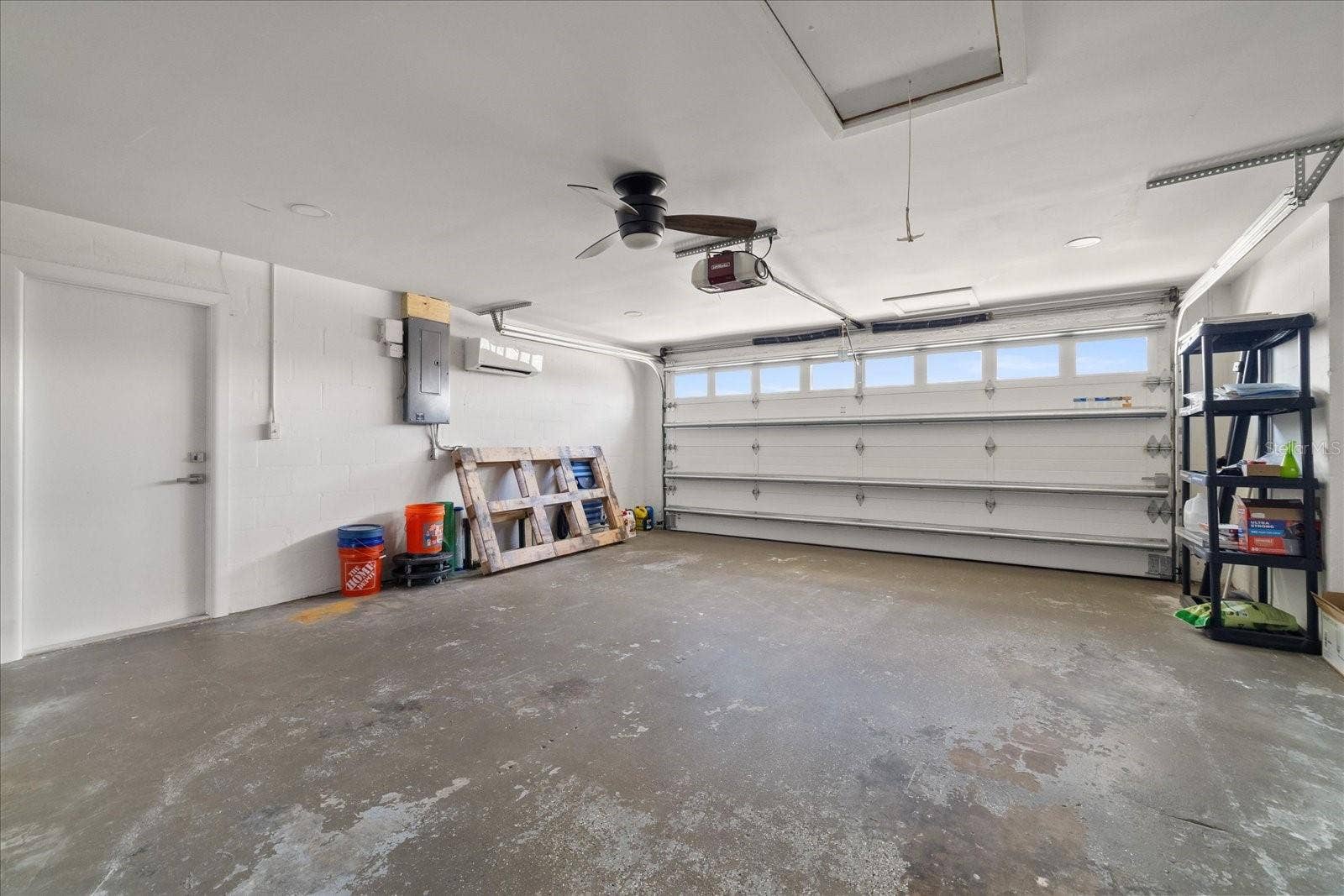 5001 MARLIN DRIVE, New Port Richey, FL 34652 Large garage with hurricane rated door and mini split.