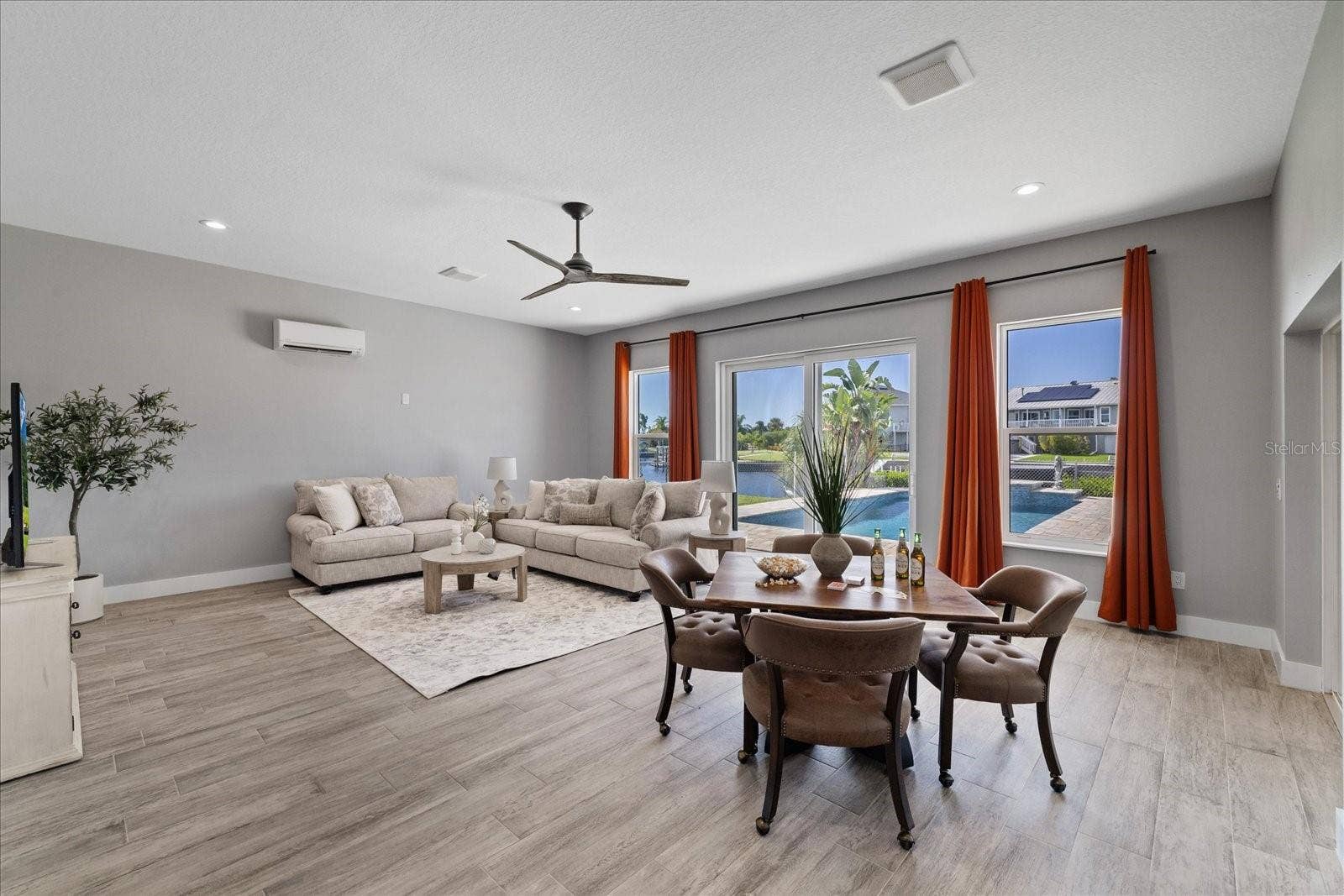 5001 MARLIN DRIVE, New Port Richey, FL 34652 Large family room with water and pool views