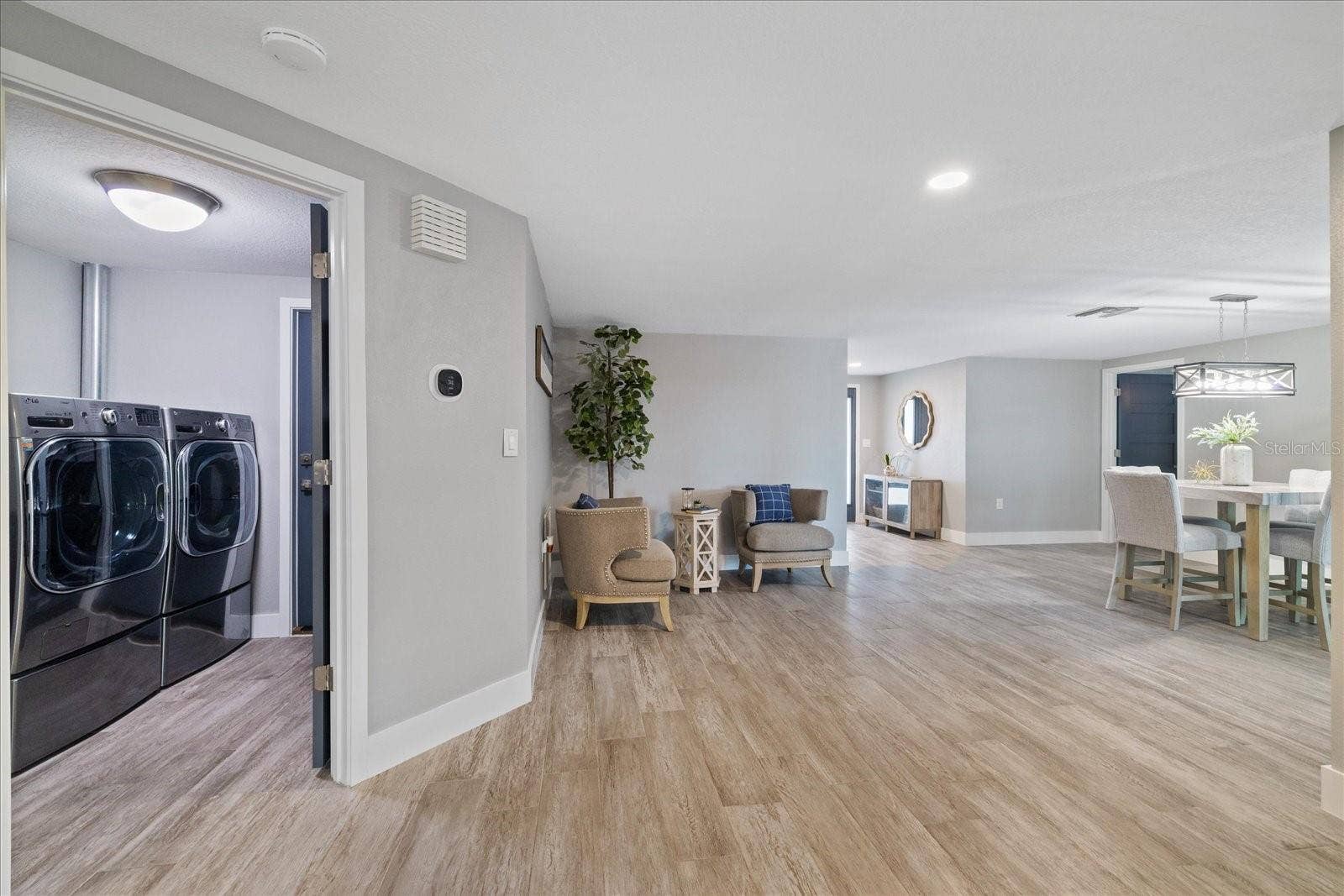 5001 MARLIN DRIVE, New Port Richey, FL 34652 Laundry room centrally located and climate controlled with garage access door.