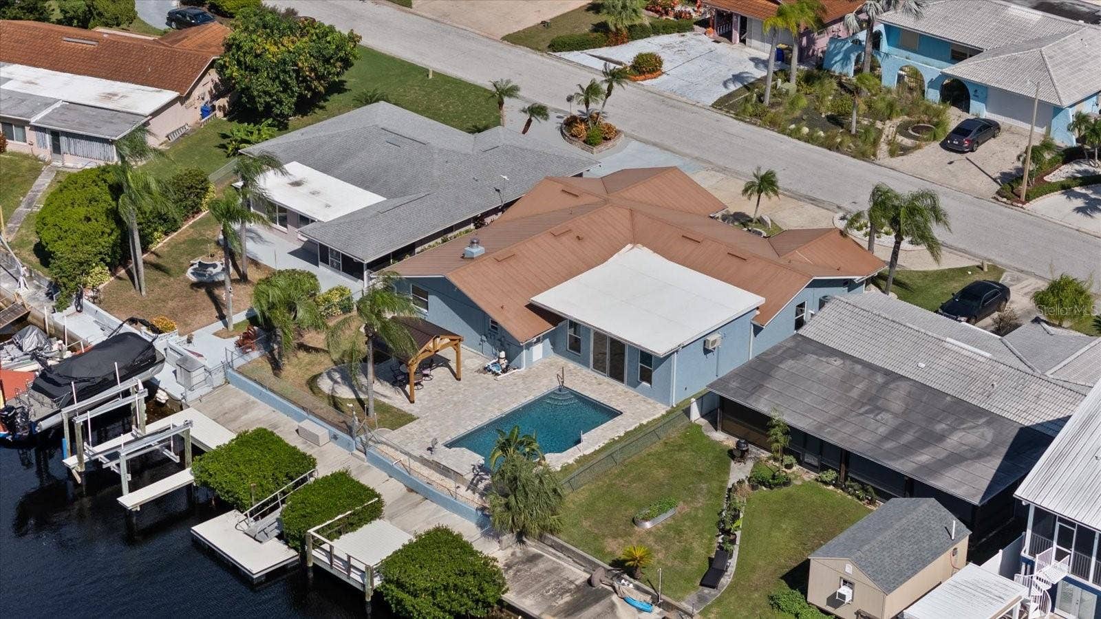 5001 MARLIN DRIVE, New Port Richey, FL 34652 Aerial of home showing waterfall pool, gazebo, boat lift, floating dock and stationary dock