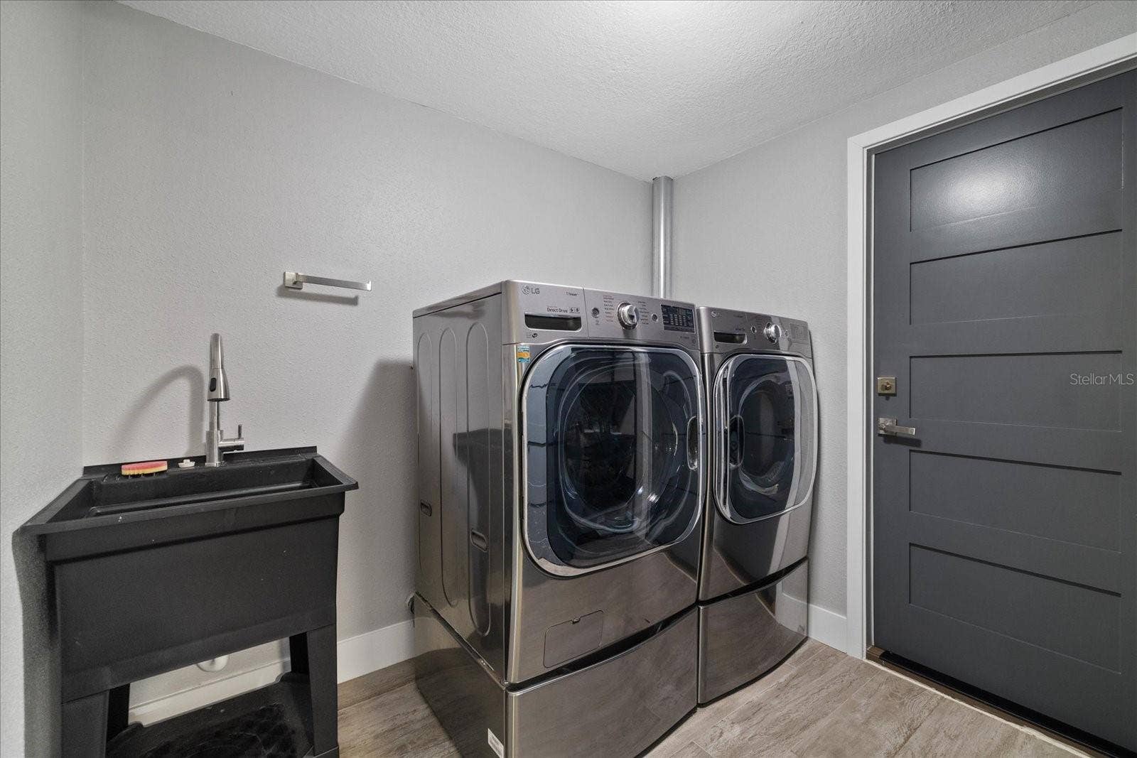 5001 MARLIN DRIVE, New Port Richey, FL 34652 Climate controlled laundry room with sink
