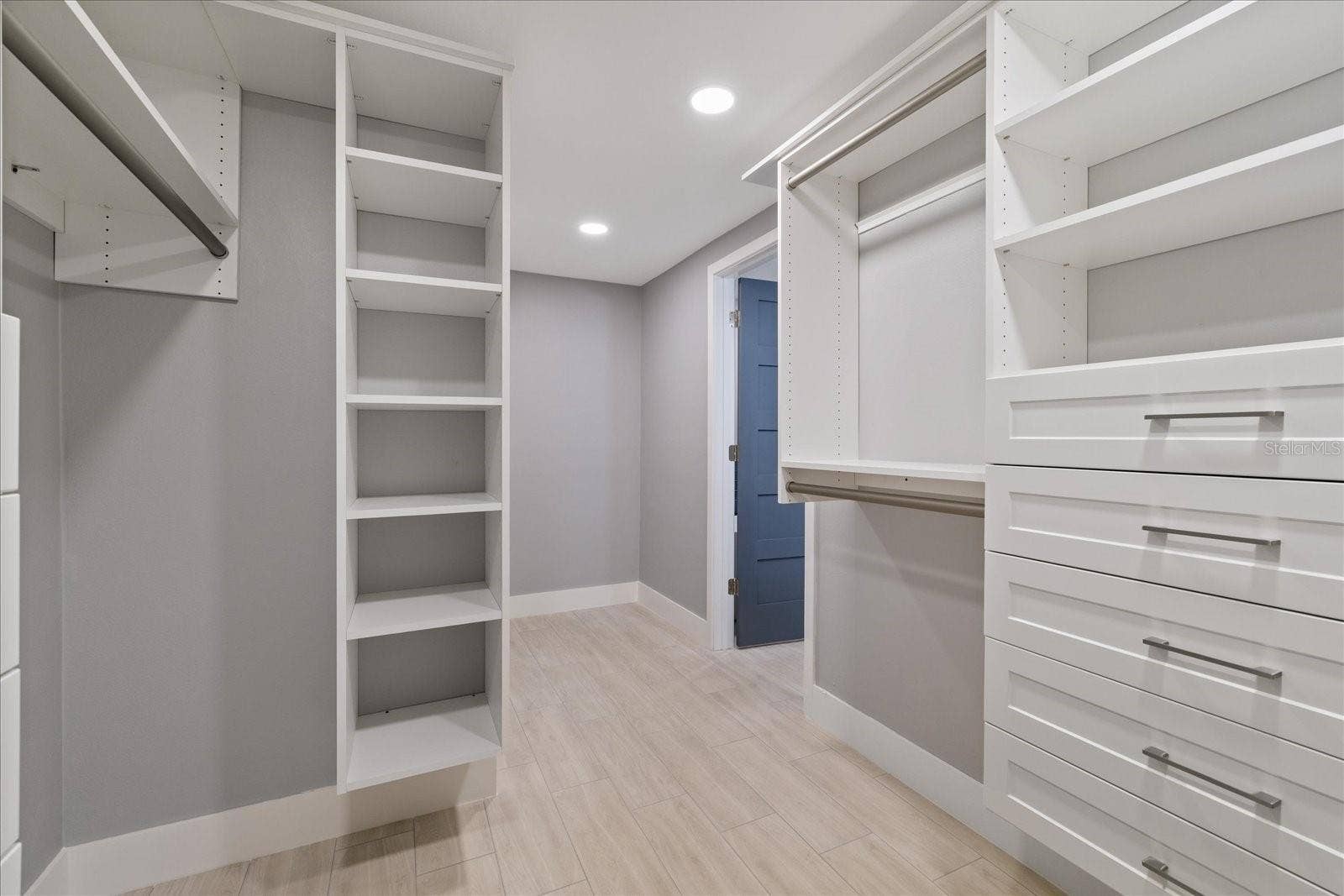 5001 MARLIN DRIVE, New Port Richey, FL 34652 Looking toward doorway inside primary walk in closet