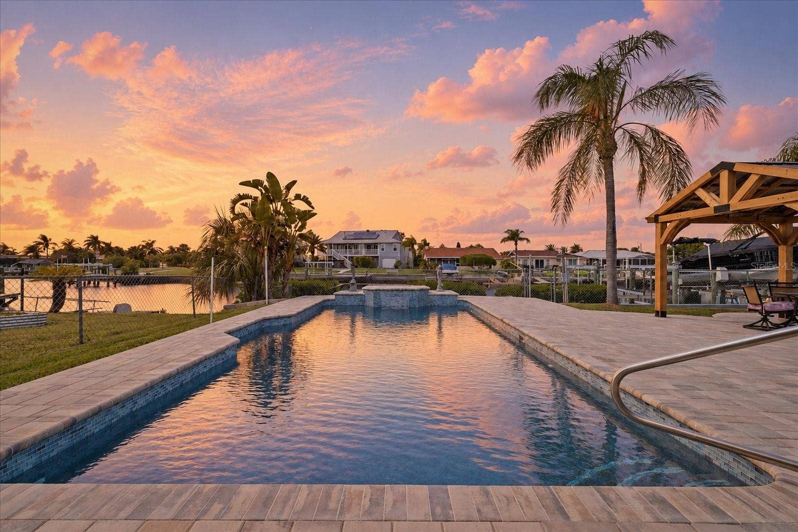 5001 MARLIN DRIVE, New Port Richey, FL 34652 Virtually enhanced- sunset pool views facing west.